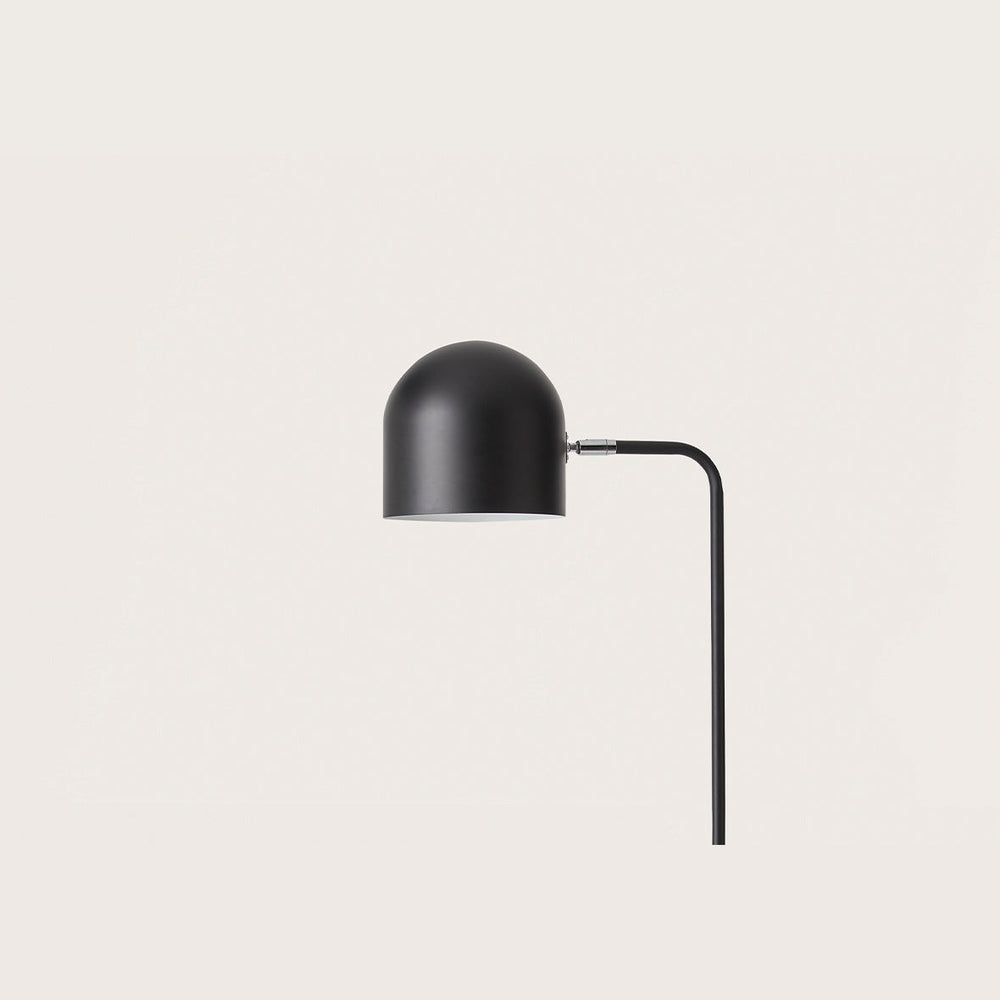 Luca Floor Lamp close-up of the matt black dome shade and curved stem