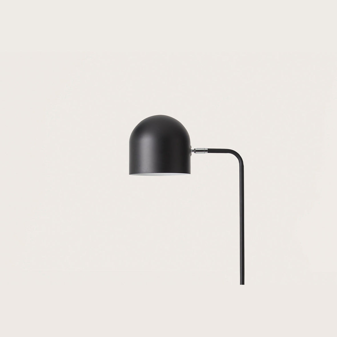 Luca Floor Lamp close-up of the matt black dome shade and curved stem