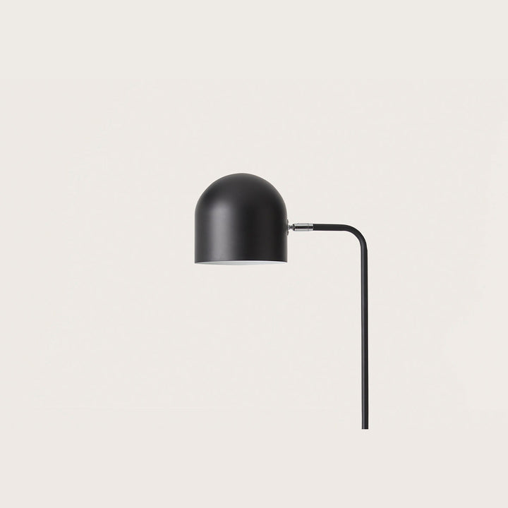 Luca Floor Lamp close-up of the matt black dome shade and curved stem