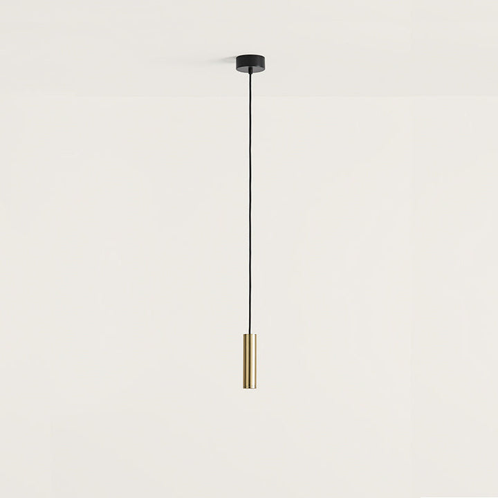 Maru Pendant Lamp, slim brass cylinder on a black cord with black ceiling canopy, unlit, by Aromas del Campo
