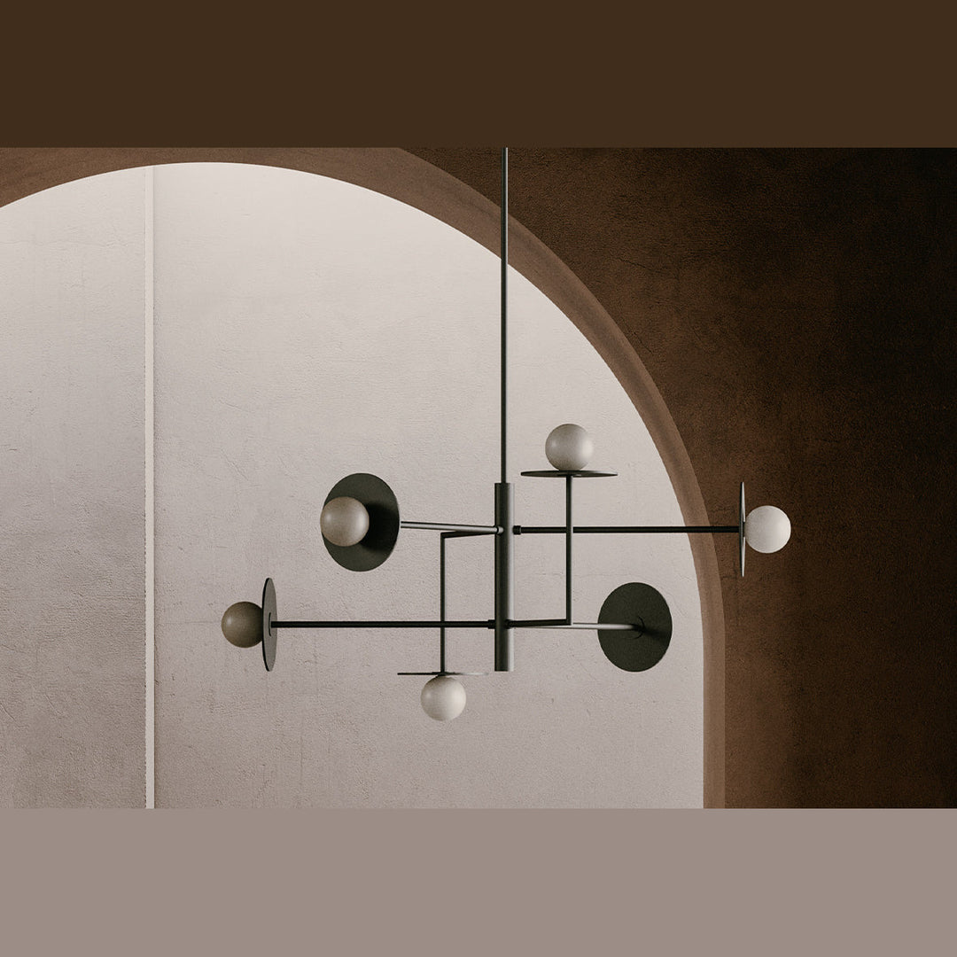 Pendant with black and dark discs and opal globes hung under a plaster arch