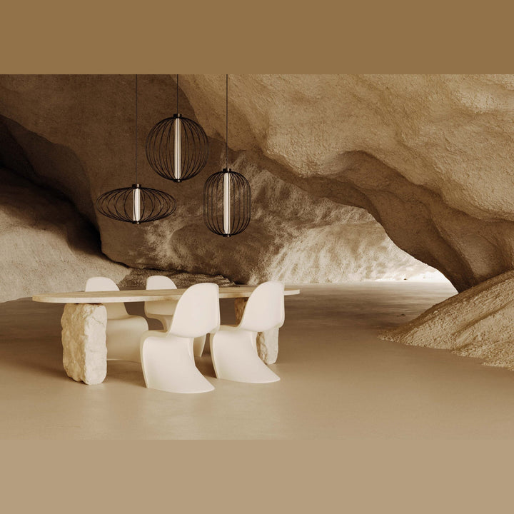 Pepo Pendant Lamp, Large (Ø27.7 in), trio lit over a white dining table and chairs in a sculpted sand-stone space