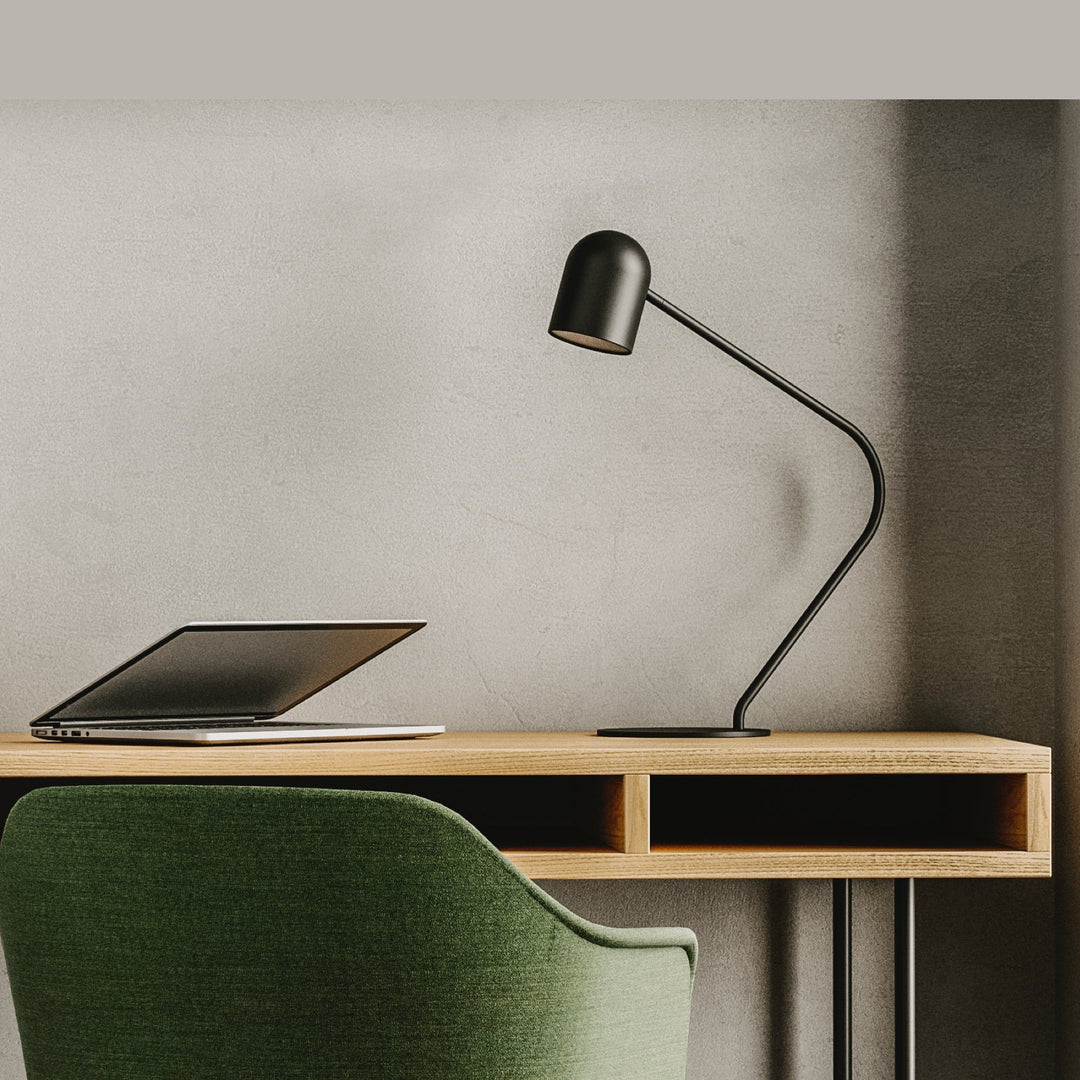 Black Pipe Table Lamp on an oak desk with a laptop and green upholstered chair