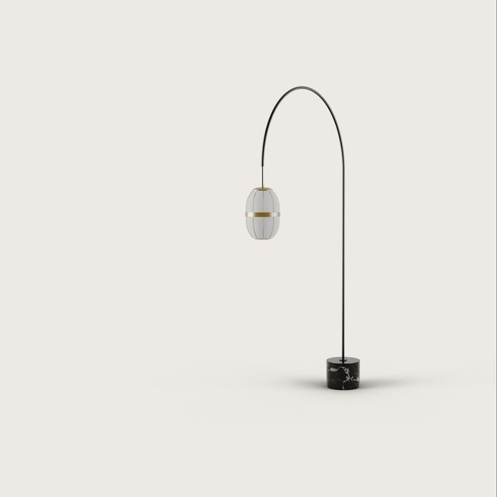Pull Floor Lamp, black arched arm with an oval linen lantern shade on a black marble base, by Aromas del Campo