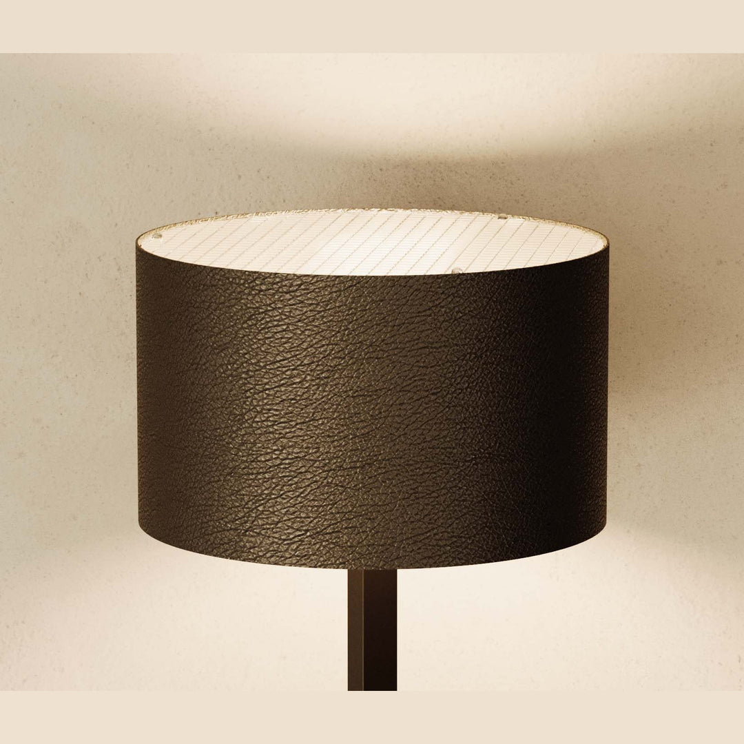 Rems Floor Lamp close-up of the textured dark brown leather shade, lit from inside