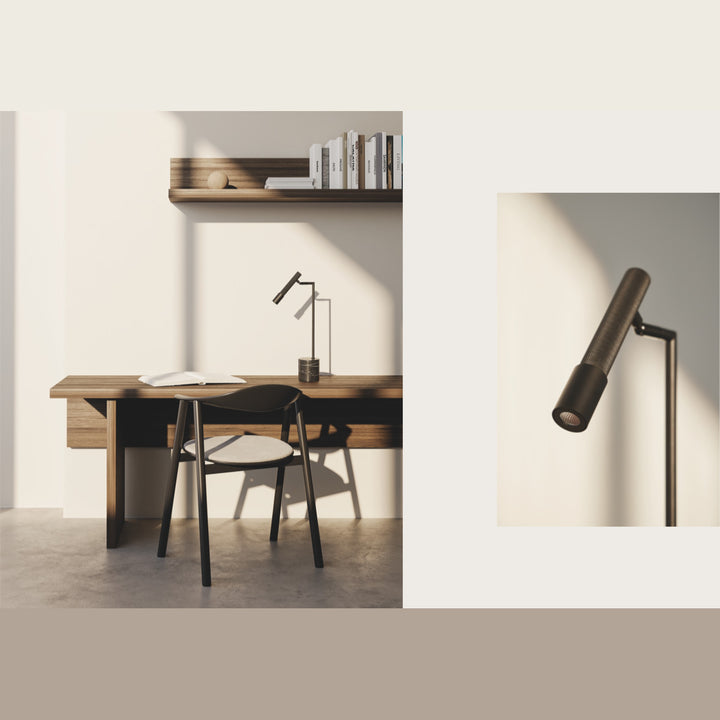 Ycro Table Lamp on a wooden desk with a black chair and wall shelf, with a close-up of the spot head