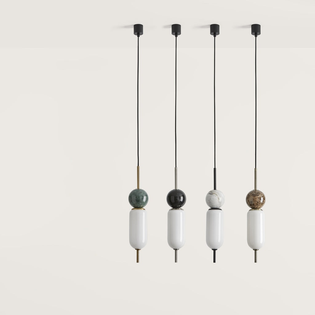 Four pendant lights with spherical decorative elements on a white background