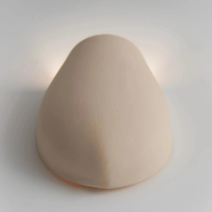 Sanctuary I Ceramic Wall Sconce — White Stoneware, angled overhead detail of the rounded form