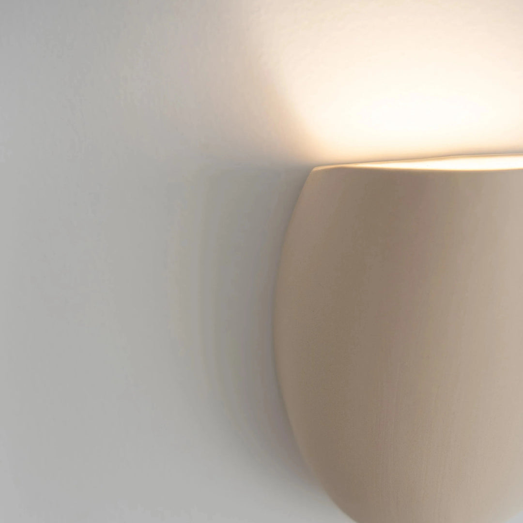 Sanctuary I Ceramic Wall Sconce — White Stoneware, side profile detail showing the curved silhouette
