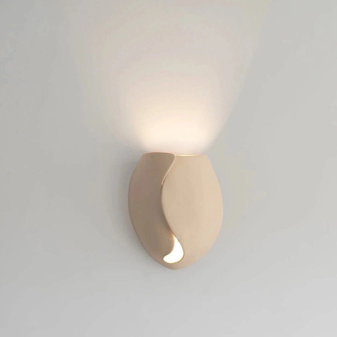 Sanctuary II Ceramic Wall Sconce — White Stoneware, full front view illuminated on the wall