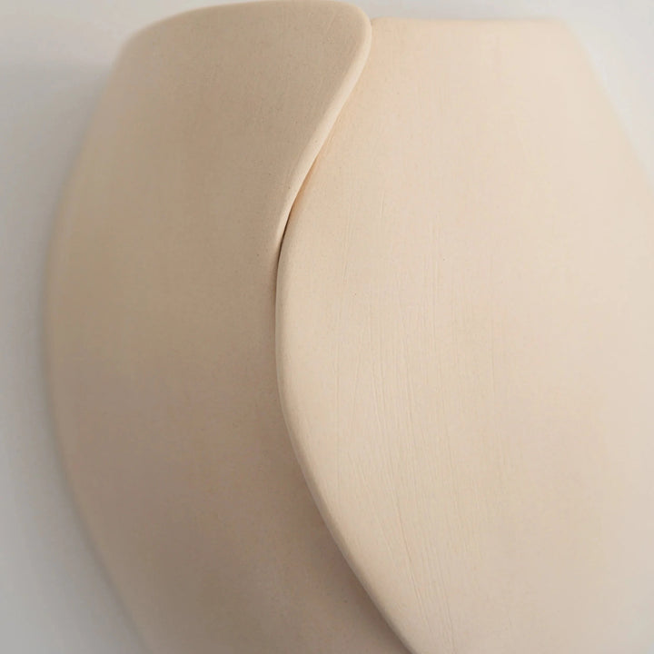 Sanctuary II Ceramic Wall Sconce — close-up detail of the overlapping wave seam texture