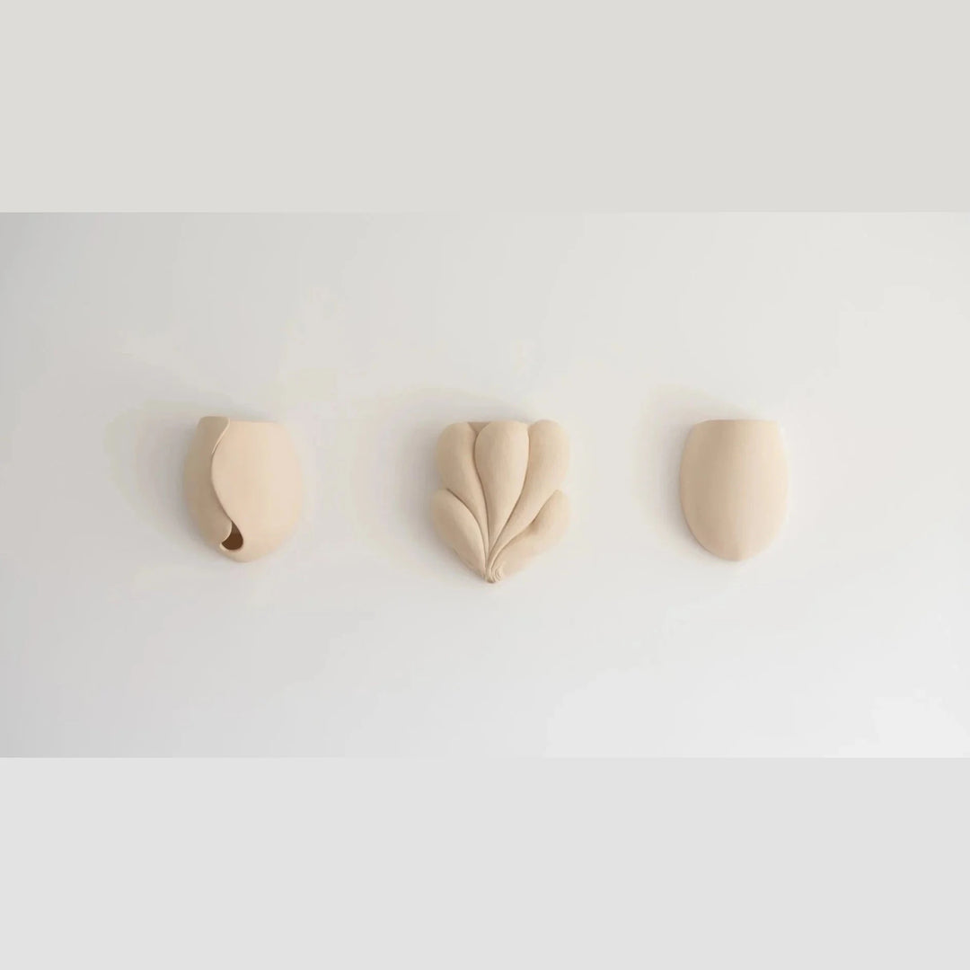 Sanctuary I Ceramic Wall Sconce — three sculptural silhouette variations shown together