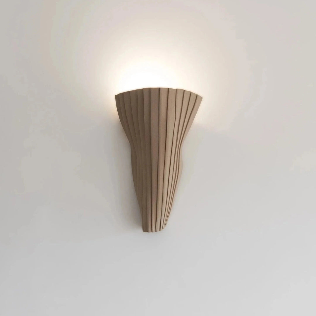 Tenderness Ceramic Wall Sconce — Toffee Stoneware, trumpet silhouette, front view illuminated