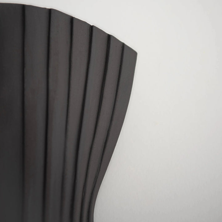 Tenderness Ceramic Wall Sconce — Black Stoneware, detail of ribbed texture and upper curve