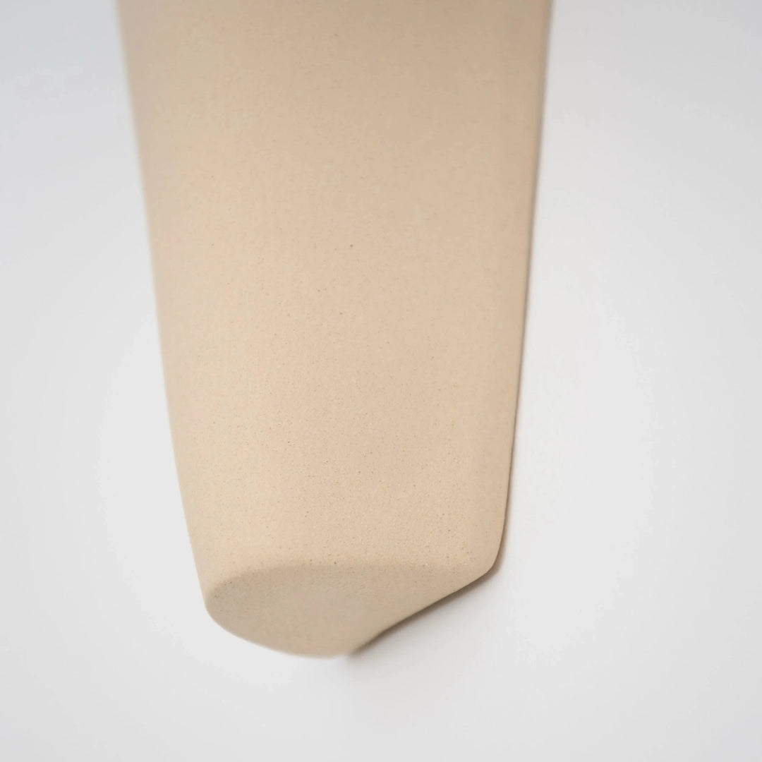 Still Lines Ceramic Wall Sconce — macro detail of the rounded ceramic tip and texture
