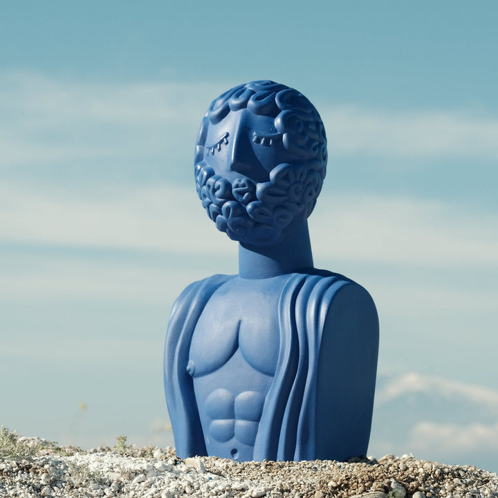 Seletti Magna Graecia Terracotta Bust Man Blue, the blue bust outdoors against sky and rock