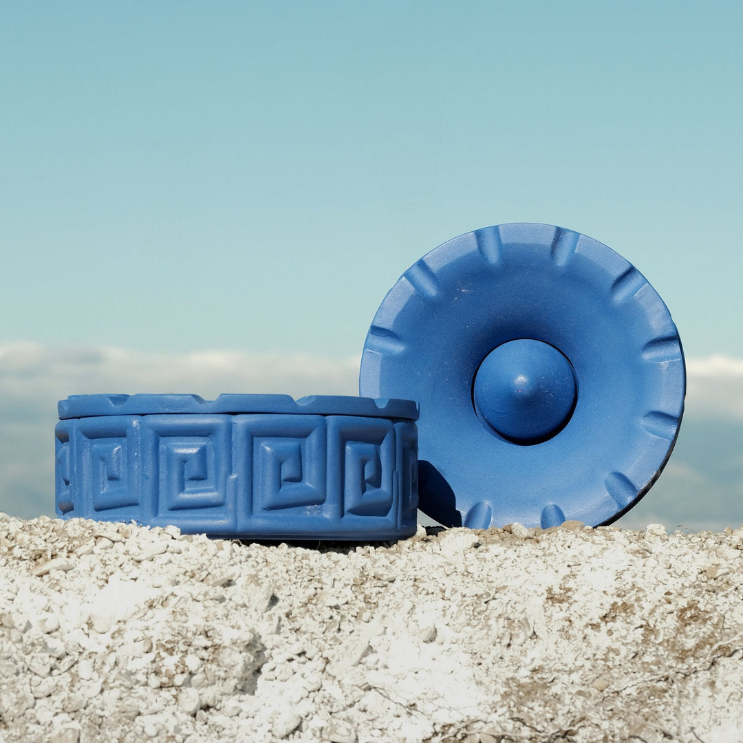 Seletti Magna Graecia Terracotta Ashtray Greche Blue, the ashtray and lid styled outdoors on rock