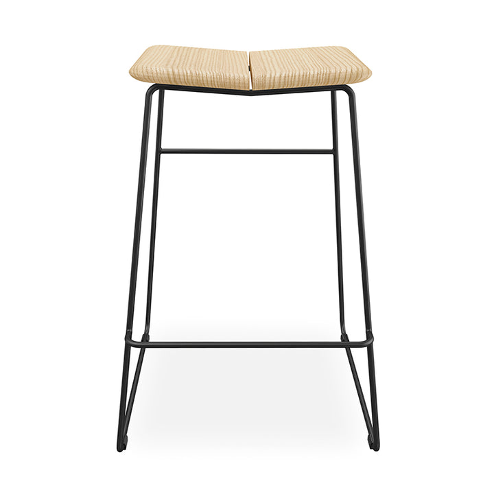Woven rattan bar stool with black metal frame, modern minimalist design for contemporary interiors