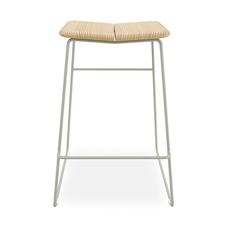 Minimalist bar stool with woven rattan seat and sage metal frame, modern designer furniture
