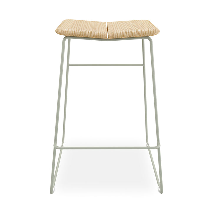 Minimalist bar stool with woven rattan seat and sage metal frame, modern designer furniture