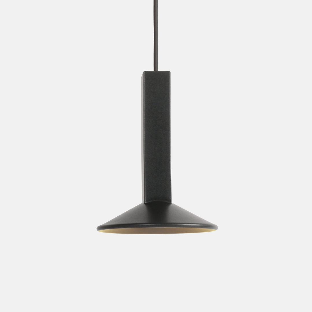 Matte black pendant light with brass interior, minimalist design for modern interiors
