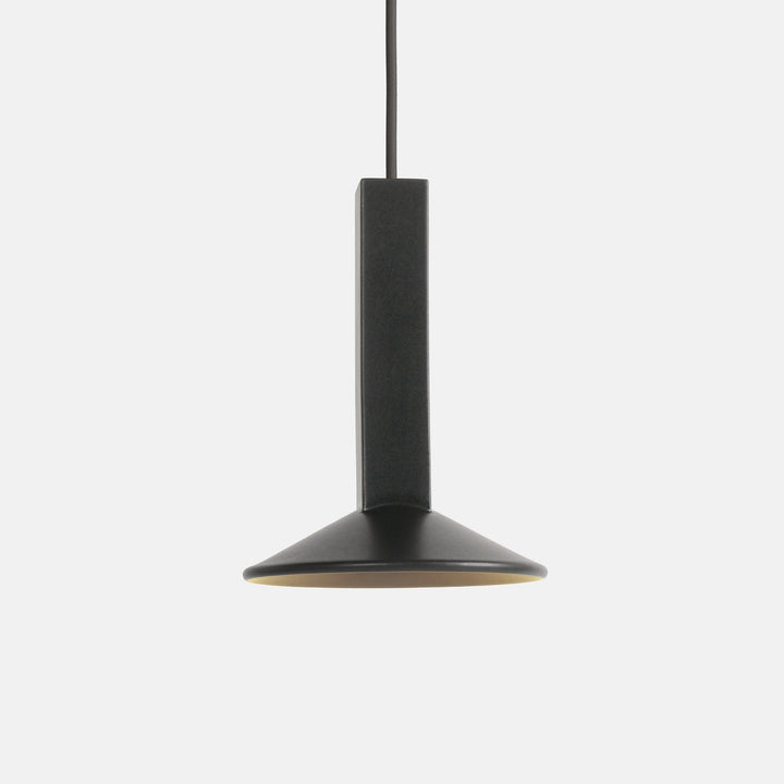 Matte black pendant light with brass interior, minimalist design for modern interiors