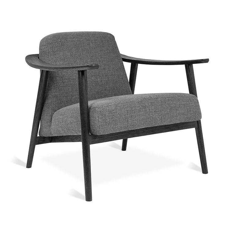 Elegant gray upholstered armchair with dark wood frame, modern designer furniture
