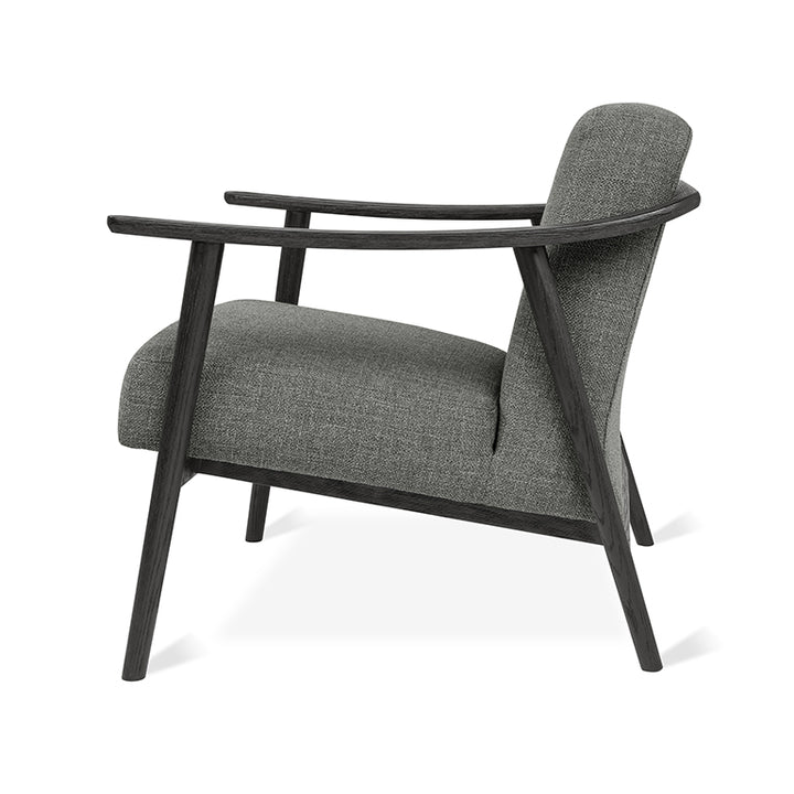 Elegant gray upholstered armchair with dark wood frame, modern designer furniture