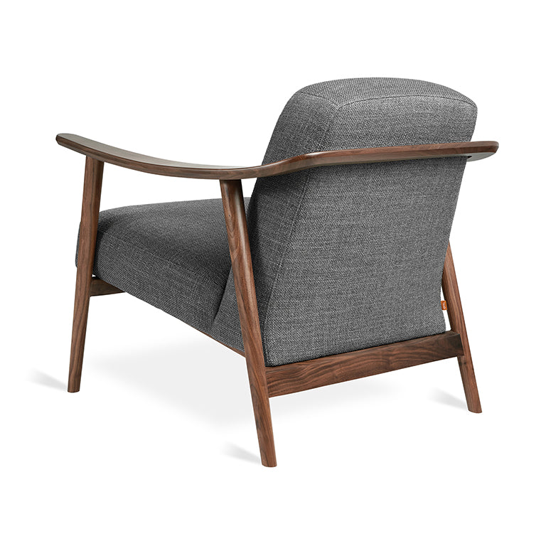 Mid-century modern armchair in walnut wood and charcoal textured fabric, sleek curved design