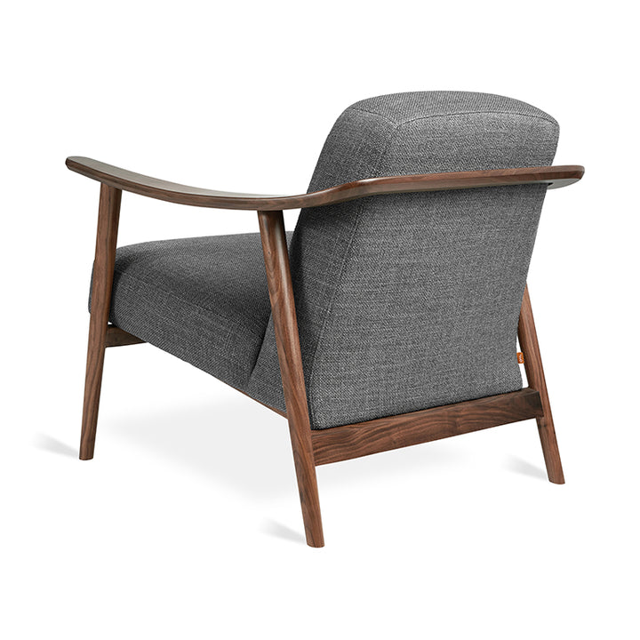 Mid-century modern armchair in walnut wood and charcoal textured fabric, sleek curved design