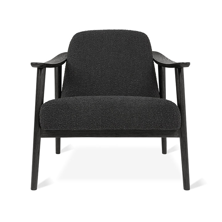 Black bouclé armchair with dark wood frame, modern designer furniture
