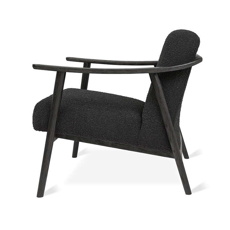 Black bouclé armchair with dark oak frame, modern designer lounge chair