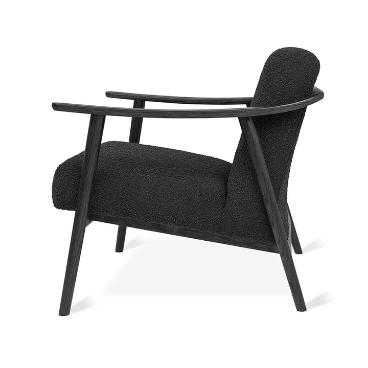 Black bouclé armchair with dark oak frame, modern designer lounge chair