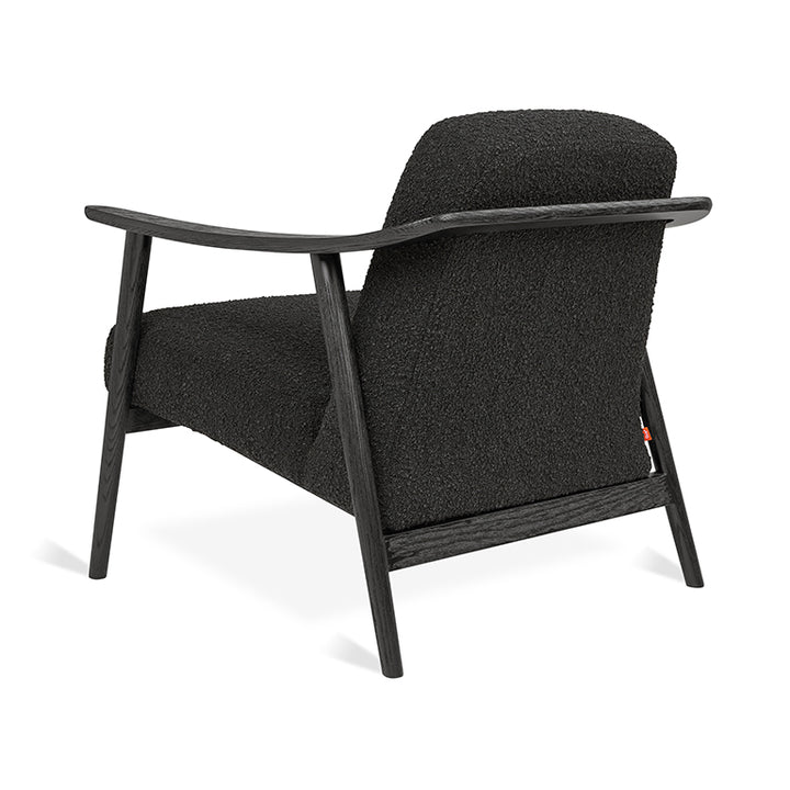 Black bouclé armchair with dark oak frame, mid-century modern design