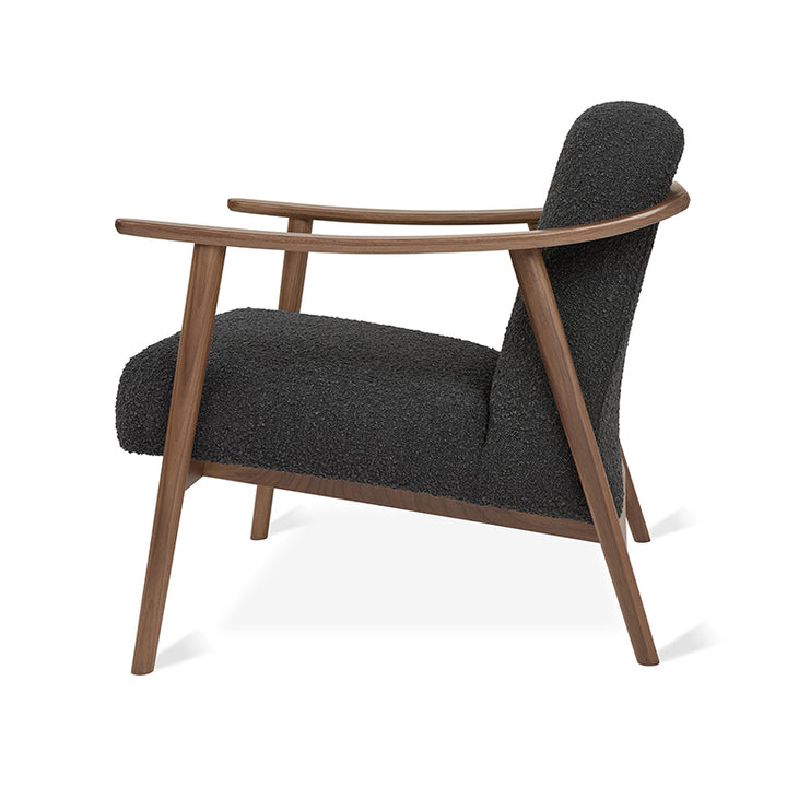 Mid-century modern armchair with walnut frame and textured charcoal upholstery