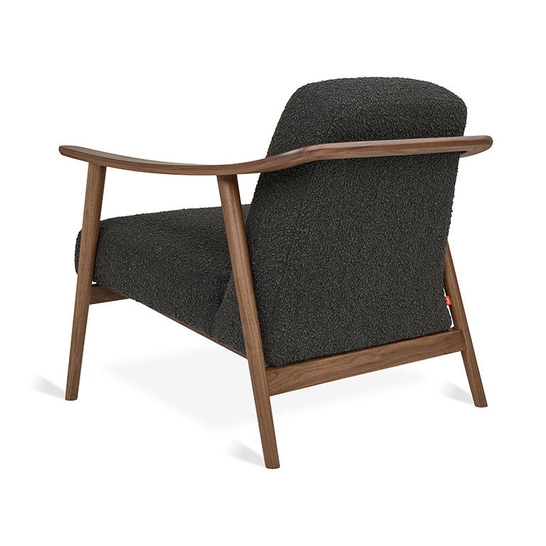 Mid-century modern armchair with walnut wood frame and textured charcoal upholstery