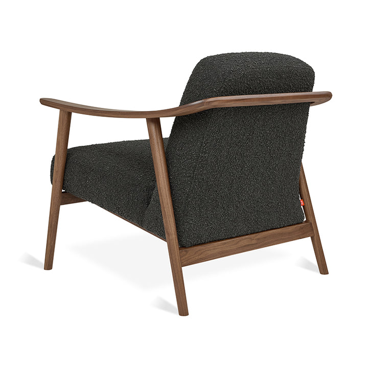 Mid-century modern armchair with walnut wood frame and textured charcoal upholstery