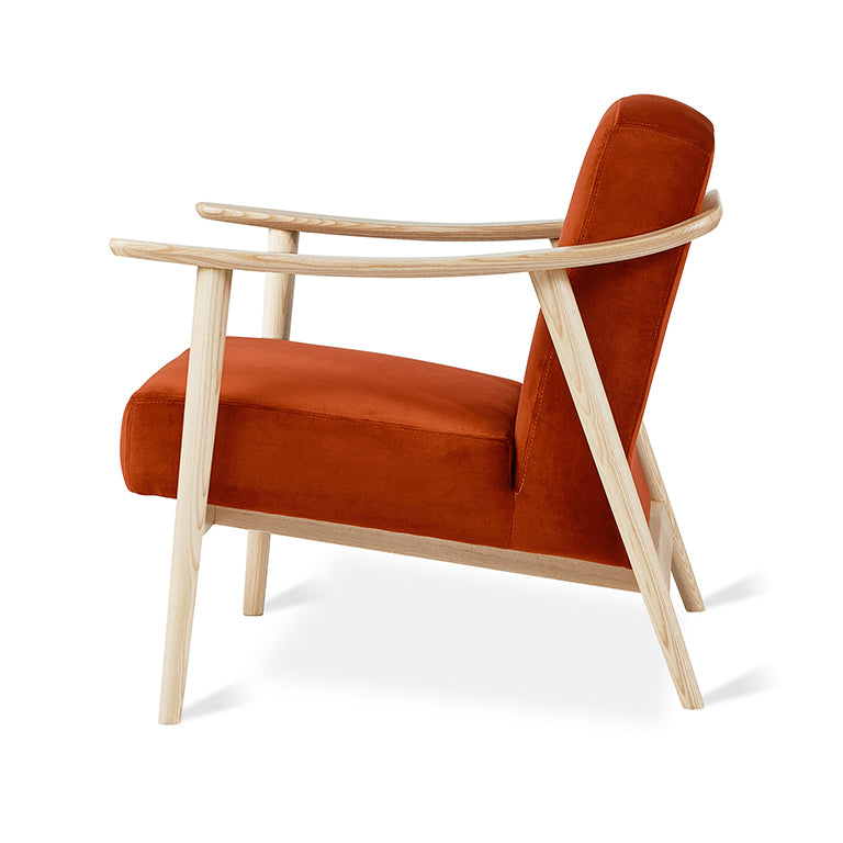 Rust velvet armchair with light oak frame, modern designer furniture