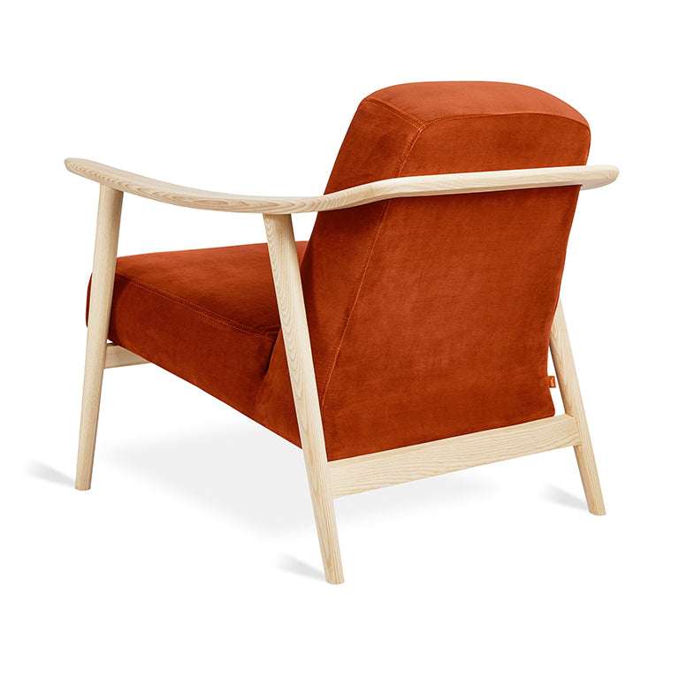 Rust velvet armchair with light oak frame, modern designer furniture