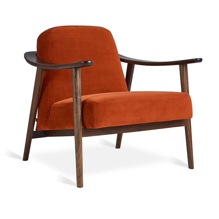 Mid-century modern armchair in burnt orange velvet with walnut wood frame