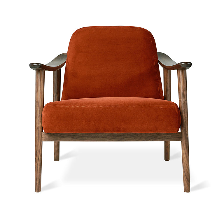 Rust velvet armchair with walnut wood frame, modern designer furniture