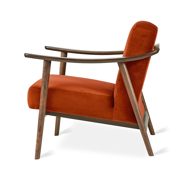 Rust velvet armchair with walnut wood frame, modern designer furniture