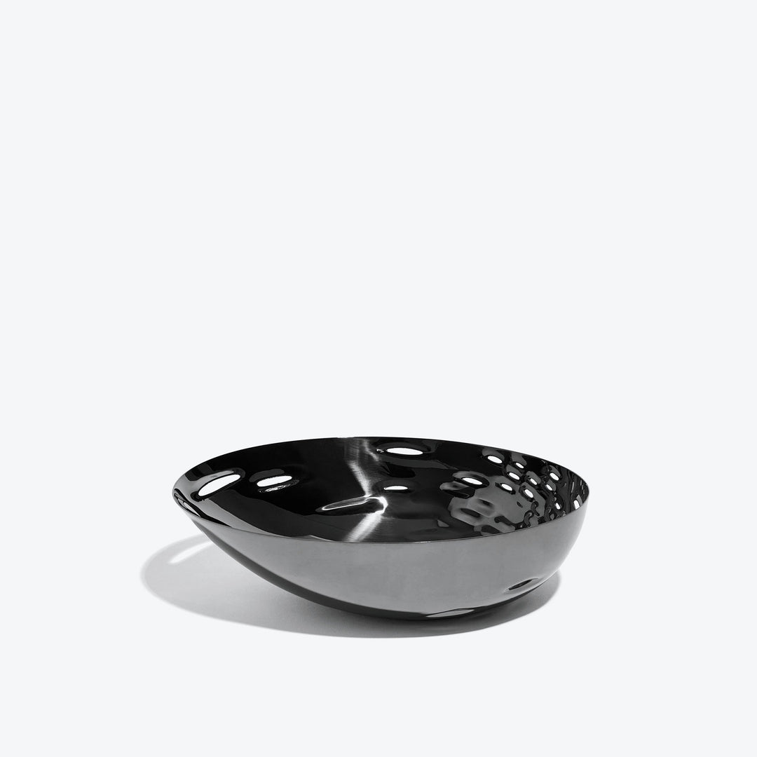 Cell Bowl — small black bowl with dimpled interior, side view on a white background