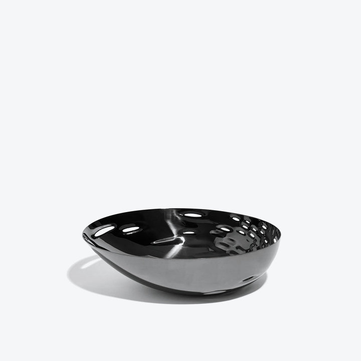 Cell Bowl — small black bowl with dimpled interior, side view on a white background