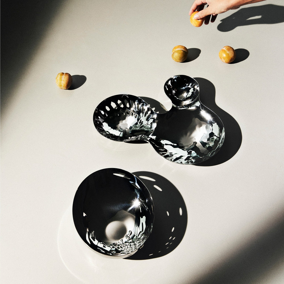 Cell Bowl — polished small and large bowls in sunlight with apricots on a pale table, top-down lifestyle view