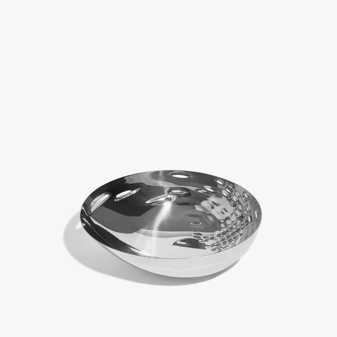 Cell Bowl — small silver bowl, three-quarter view of the cell-pattern interior on a white background