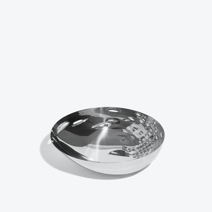 Cell Bowl — small silver bowl, three-quarter view of the cell-pattern interior on a white background