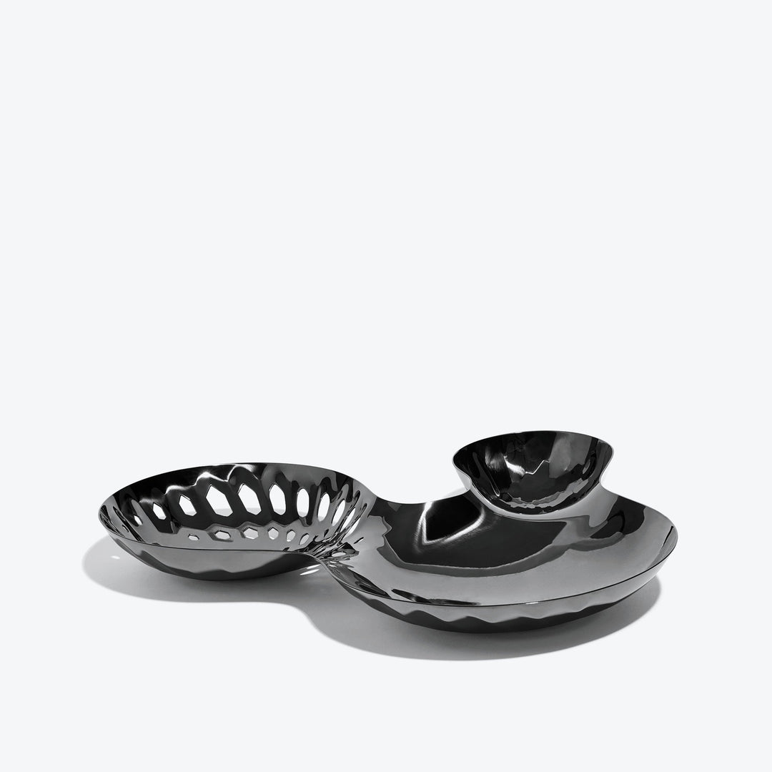 Cell Bowl — large black three-well bowl with pierced cells, side view on a white background