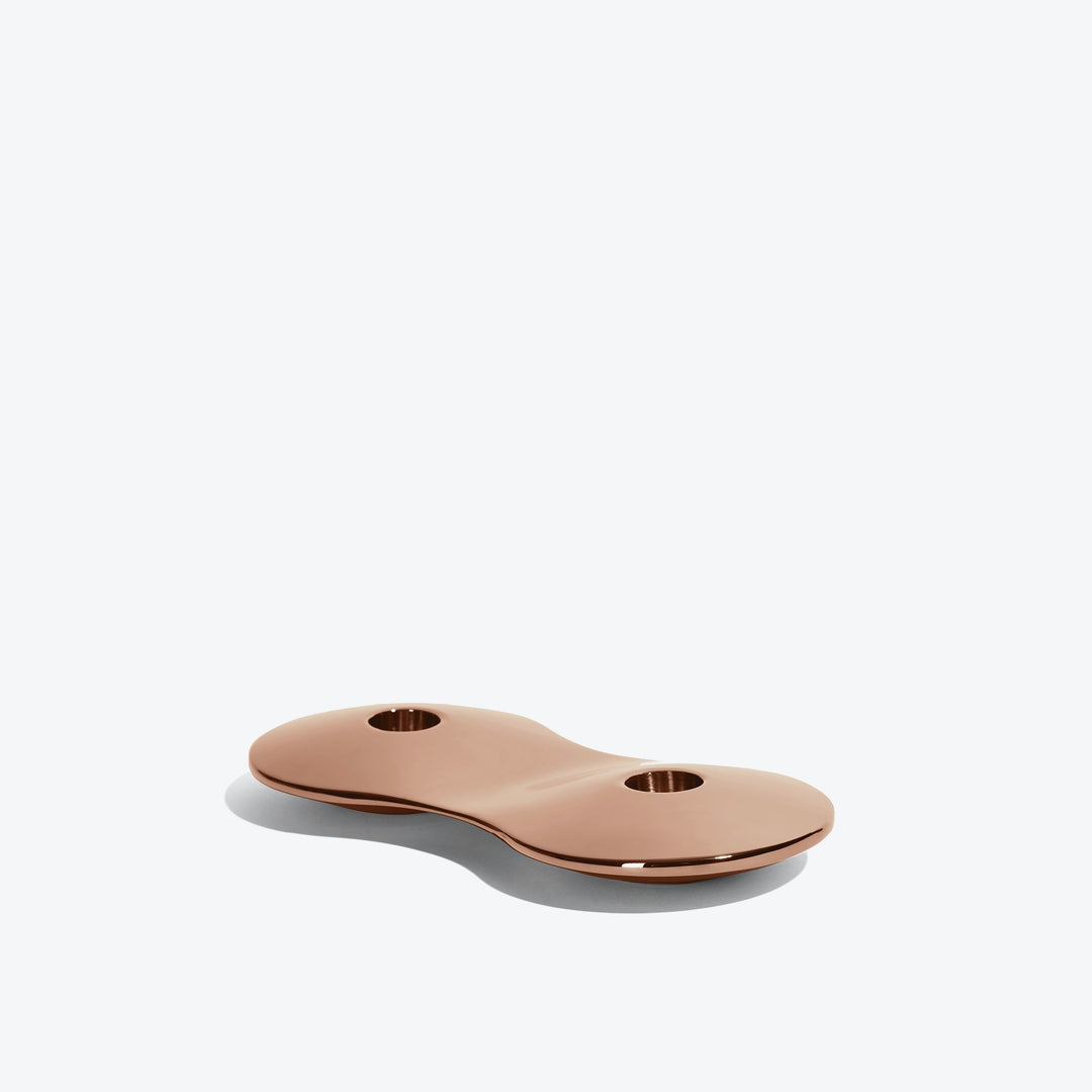 Cell Candle Holder — small rose gold two-candle piece, low side view on a white background