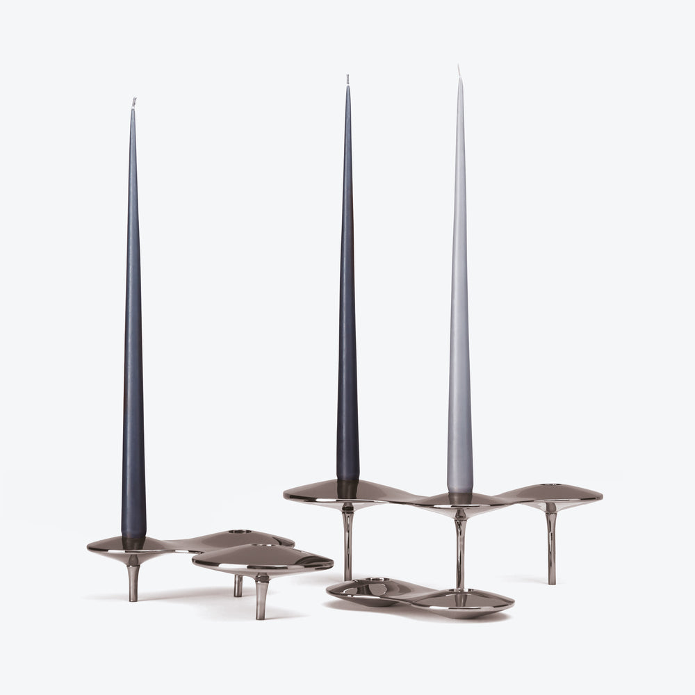 Tapered Candle, Set of 4 — dark and light grey candles in polished silver-tone Cell Candle Holders on white